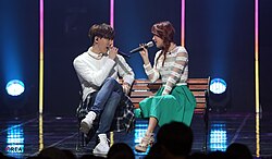 Soyou and Junggigo performing the song