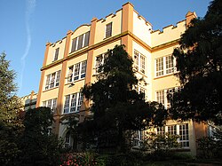 A secondary school behind trees