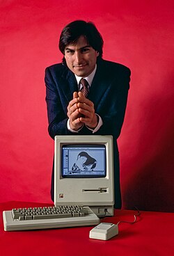 Steve Jobs in 1984 with the Macintosh, the first successful mass-market personal computer to feature an integral graphical user interface and mouse