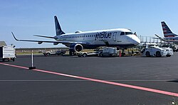 A JetBlue Embraer ERJ 190-100 parked on the apron at Nantucket Regional Airport in 2017