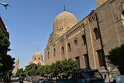 Barsbay's mausoleum complex in Cairo, completed in 1432. The carved dome (center) covers his tomb.[117]