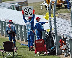 A sign announcing that the safety car (SC) is deployed