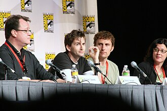 Tennant with Doctor Who showrunner Russell T Davies (left), regular director Euros Lyn (centre right), and executive producer Julie Gardner (right) at San Diego Comic-Con in July 2009