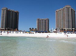 Visitors enjoying the beach at Pensacola Beach
