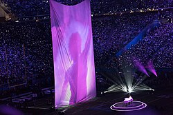 Justin Timberlake performs on piano alongside projected archive footage of Prince during the Super Bowl LII halftime show