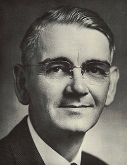 Black and white portrait of a middle-aged male.