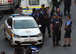 Cape Town Metro Police officers and a Metro Police vehicle