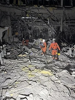 Rescuers searching the rubble of the partially-collapsed Aeon Mall Kumamoto in Kashima