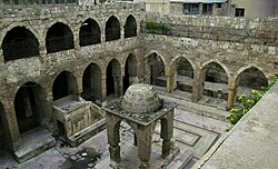 The courtyard of the synagogue and its outdoor Tevah in 2011