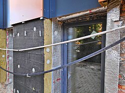 Thermal insulation works with mineral wool and aluminium composite mat