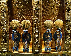 The reverse side of the throne of Pharaoh Tutankhamun with four golden uraeus cobra figures. Gold with lapis lazuli; Valley of the Kings, Thebes (1347–37 BCE).