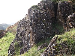 Altered serpentinite and associated sediments of the Highland Border Complex caught up in the fault zone – exposed on Druim nam Buraich, near Balmaha