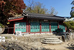 A shrine building with a sloped roof