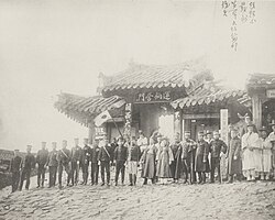Japanese military leaders and local Korean officiers before a depot of supplies in Uiju, Korea, near the boarder with Manchuria