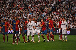 Players jostle in Barcelona's 2–6 win against Real Madrid at the Santiago Bernabéu Stadium in a 2009 El Clásico.