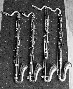 Four modern short bass clarinets, from left to right Leblanc L400, Signet Selmer 1430P, E. M. Winston, Leblanc 330S