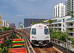 A C151B MRT train approaching Eunos station