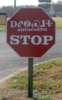 Bilingual stop sign in English and the Cherokee syllabary (transcription: ᎠᎴᏫᏍᏗᎭ, 'alehwisdiha'), Tahlequah, Oklahoma