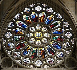 The rose window in the north transept depicts Christ and the Apostles
