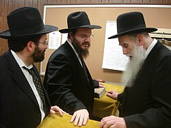 (L-R) Rabbi Yaakov Mayer and Rabbi Azriel Brown with Rabbi Aharon Feldman in 2006