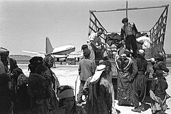 Iraqi Jews leaving Lod airport (Israel) on their way to ma'abara transit camp, 1951