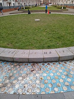 The centre spot of the former football pitch in 2026, now a green space surrounded by houses