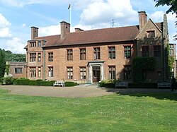 The entrance front – "long, indecisive (and) close to the road"