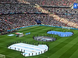 The stadium with giant sized representations of both kits, before the match