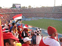 A crowd at Cairo Stadium watching the Egypt national football team
