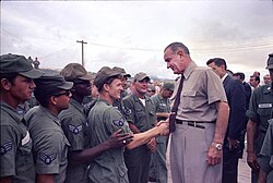 President Johnson shakes hands with U.S. airmen at Cam Ranh Bay in South Vietnam, c. October 1966.