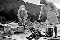 Manchukuo officials participate in a "plague prevention" operation, which is a bacteriological test directed by Japan's 'Unit 731', in November of 1940 at Nong'an County, northeast China's Jilin Province.