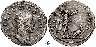 This coin was issued by Roman emperor Gallienus to celebrate the V Macedonica, whose symbol, the eagle, is crowned of wrath by Victoria. The legend on the reverse says LEG V MAC VI P VI F, which means "Legio V Macedonica VI times faithful VI times loyal"