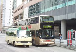 A public light bus (left) and a double-decker bus (right) in Hong Kong