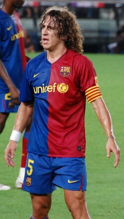 Puyol as Barcelona captain (wearing his Catalan flag armband) in 2008