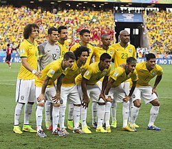 Brazil line-up against Colombia at the 2014 FIFA World Cup. Neymar (front row, second from right) would play his last game at the tournament after being stretchered off with a fractured vertebra.