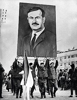 Syrians marching with portrait of Assad