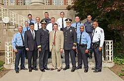 NIH Police Officers in uniform. Lieutenants and above wear white shirts, Sergeants and below wear blue shirts, and K-9 officers wear dark blue/grey uniforms.
