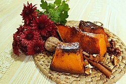 Baked pumpkin with powdered sugar and cinnamon