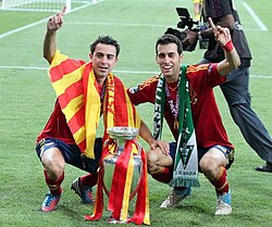 Xavi and Busquets with the Henri Delaunay Trophy after Spain won Euro 2012