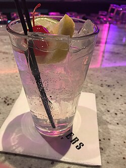 A Tom Collins, served in a glass of the same name.