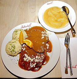 Rhenish Sauerbraten of horse meat in raisin sauce with dumplings and applesauce