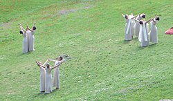 The ceremony for the lighting of the flame was arranged as a pagan pageant, with dancing priestesses.