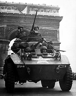 American troops in an M8 Greyhound passing the Arc de Triomphe after the liberation of Paris