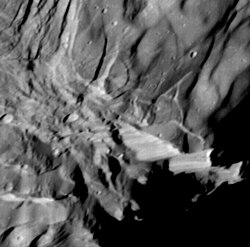 Close-up view of Verona Rupes, a cliff 5 to 10 km (3.1 to 6.2 mi) high.[46]