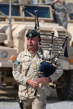 A Canadian soldier plays the bagpipes during the war in Afghanistan. Bagpipes are frequently used during funerals and memorials, especially among fire department, military and police forces in the United Kingdom, Ireland, the Commonwealth realms, and the U.S.