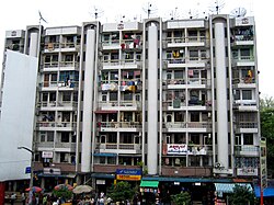 A block of apartments in downtown Yangon, facing Bogyoke Market. Much of Yangon's urban population resides in densely populated flats.