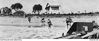 British soldiers landing at Tamatave 18 September 1942. The portside Lewis gun shelter of their LCA is visible at the bottom right