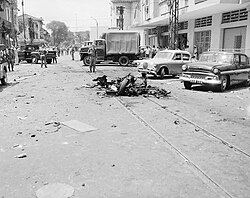 Vietcong car bombing aftermath scene in Saigon, 1965
