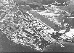 Hickam Field, 1940. Pearl Harbor Navy Yard is in the upper left corner and the main barracks is immediately left of the eight hangars in the center.