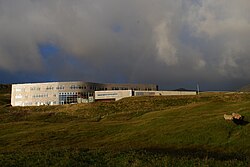 Miðnámsskúlin í Suðuroy. The school building consists of the Suðuroy Gymnasium and the Health School. It is located in Suðuroy in Porkeri, near the village Hov.
